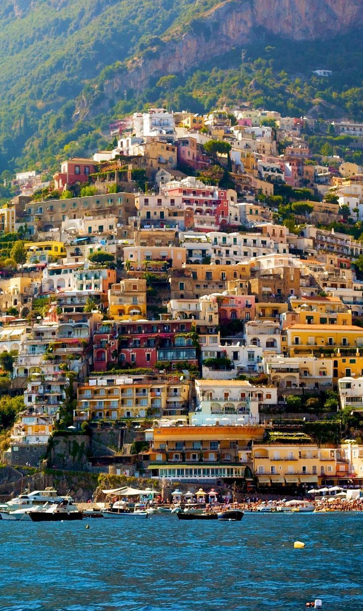 Boat leaving Positano under the Italian flag