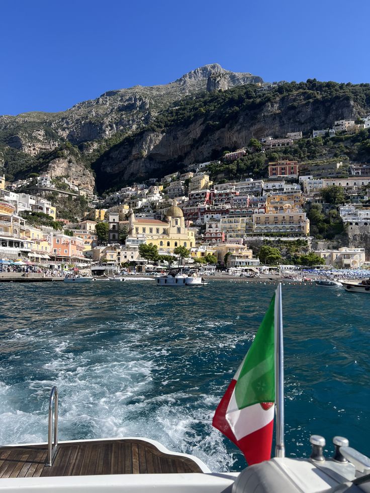 Amalfi Coast and Capri Tour — leaving Positano under the Italian flag