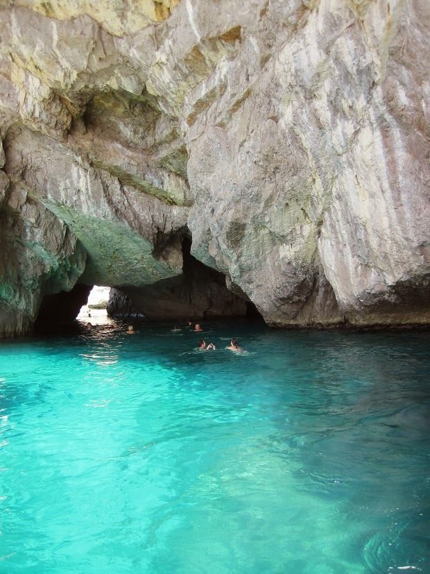 Swimming in a turquoise sea cave off Capri