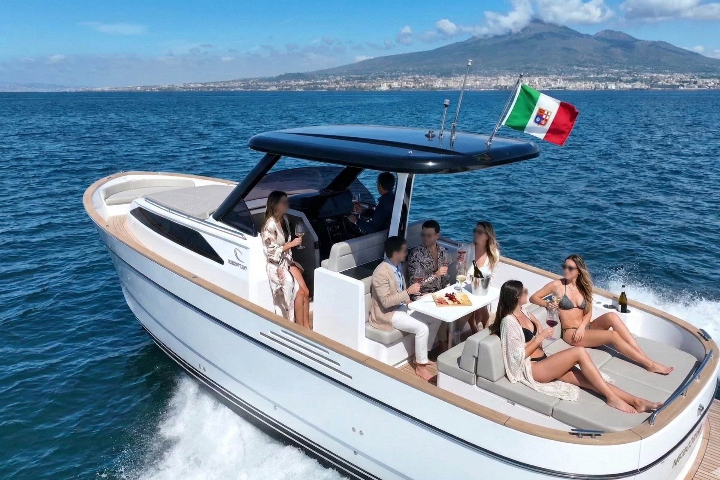 Guests enjoying drinks on the aft deck of the Apreamare Gozzo 35 with Mount Vesuvius in the background