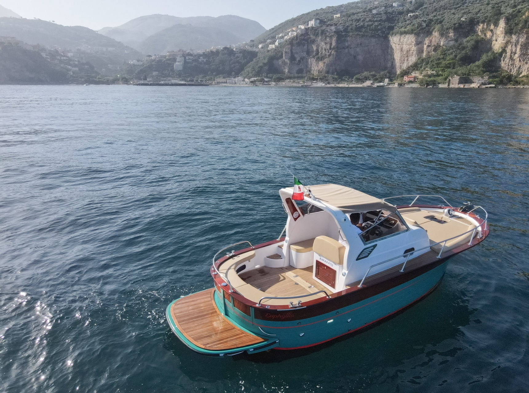 The Gozzo 26 at anchor with the Sorrento coast behind