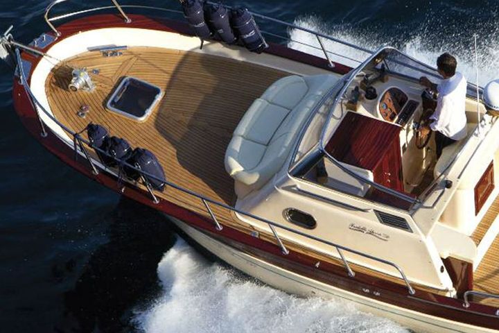 Aerial view of the Gozzo 26 cruising with the Italian flag