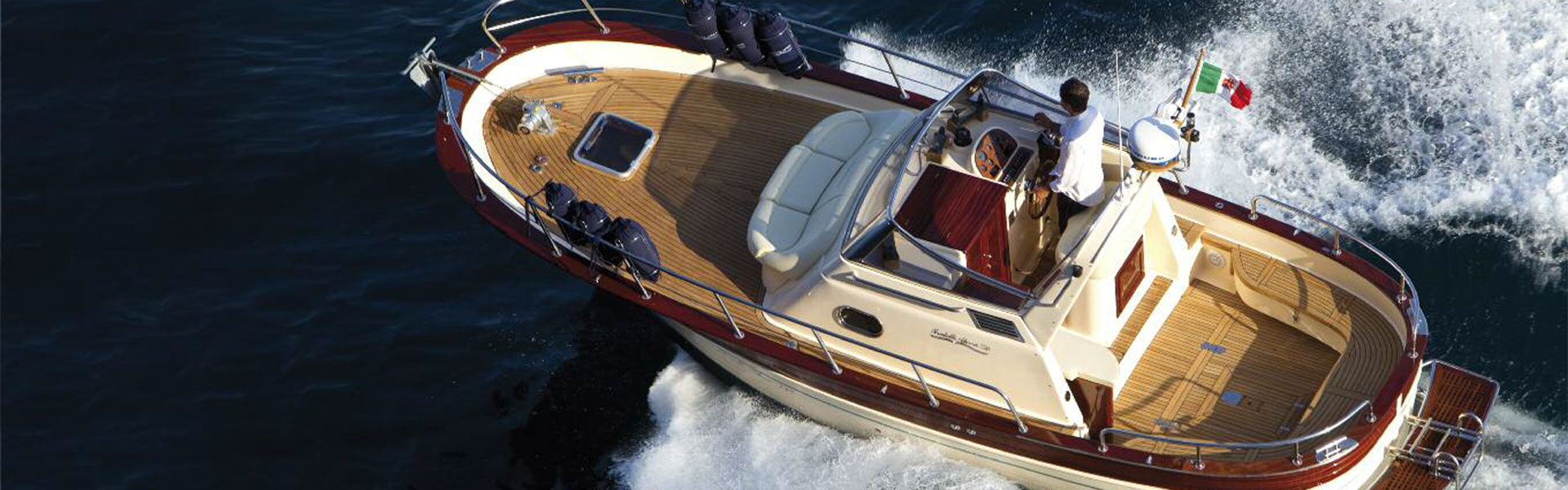 Aerial view of the Gozzo 26 cruising with the Italian flag