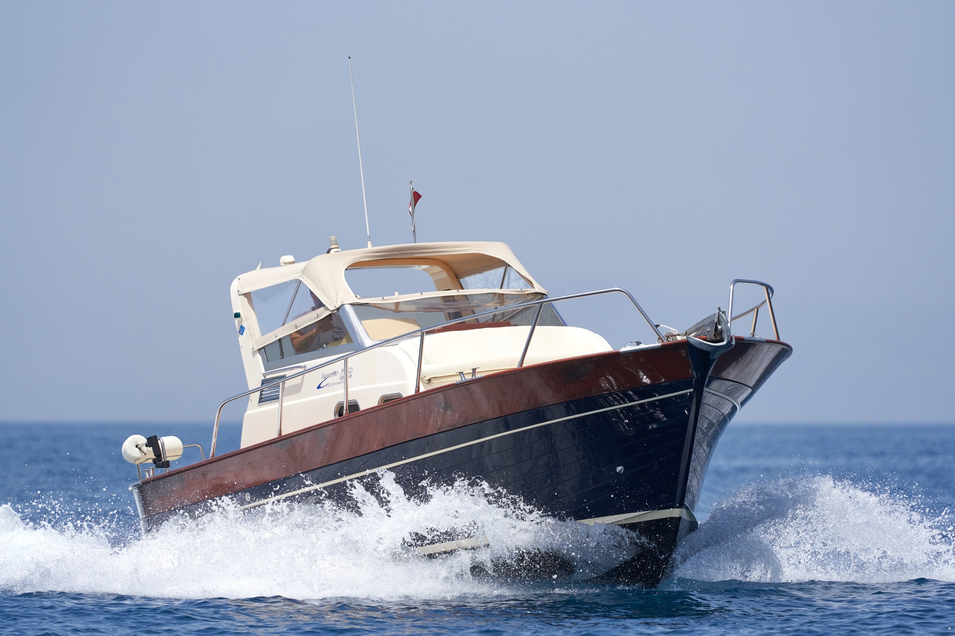 The Gozzo 26 cruising at speed off the coast