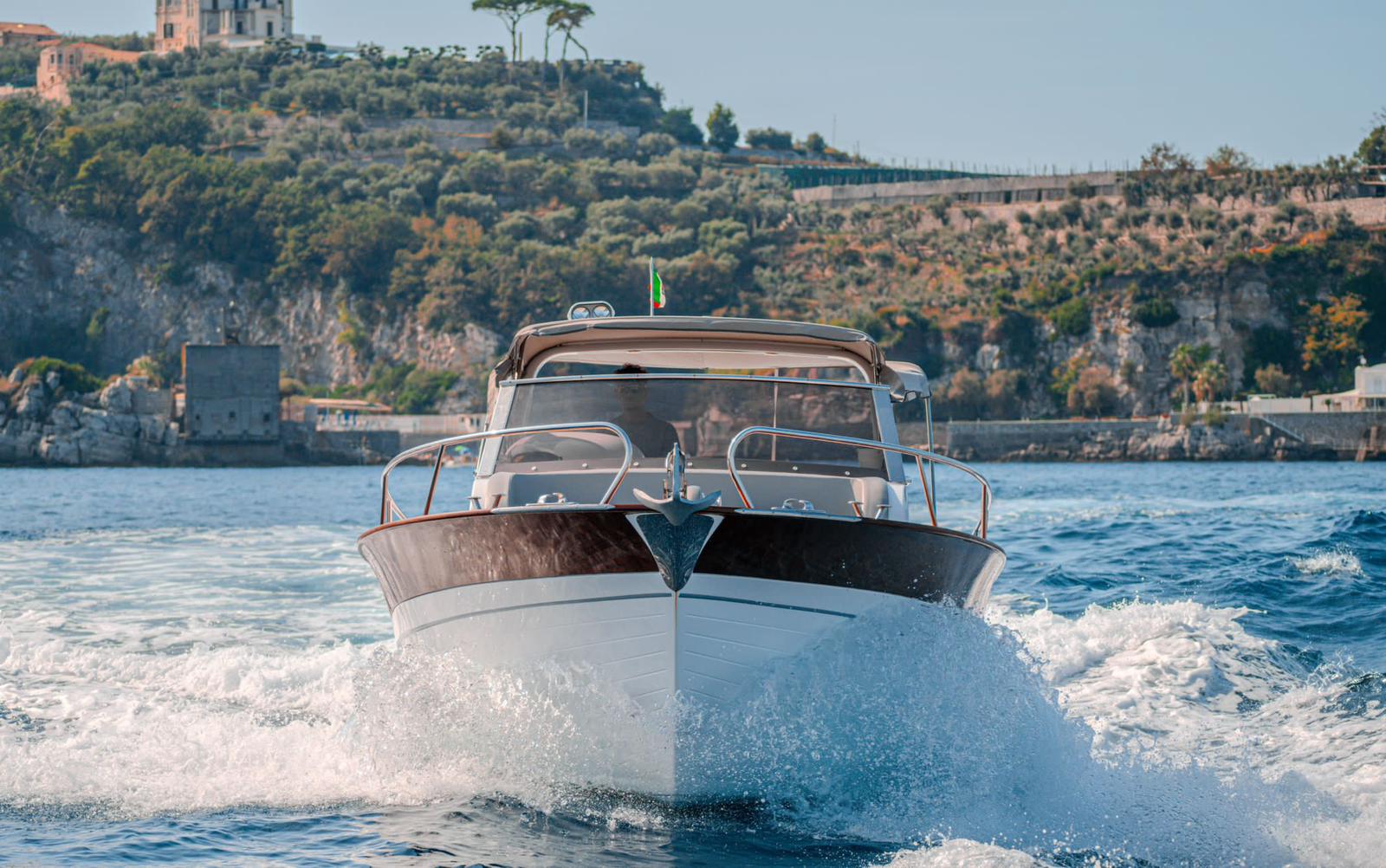 The Gozzo 30 cruising in open water, bow view