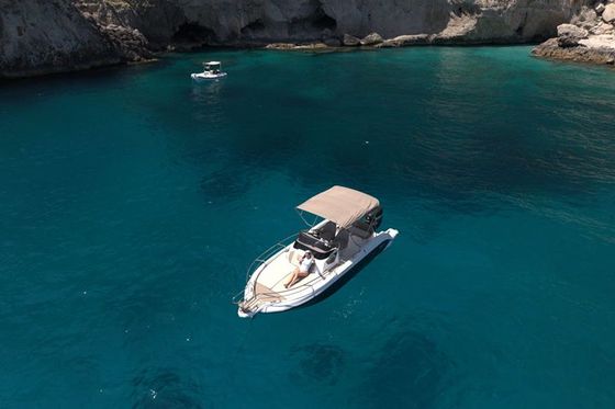 Boat in a turquoise cove near Capri