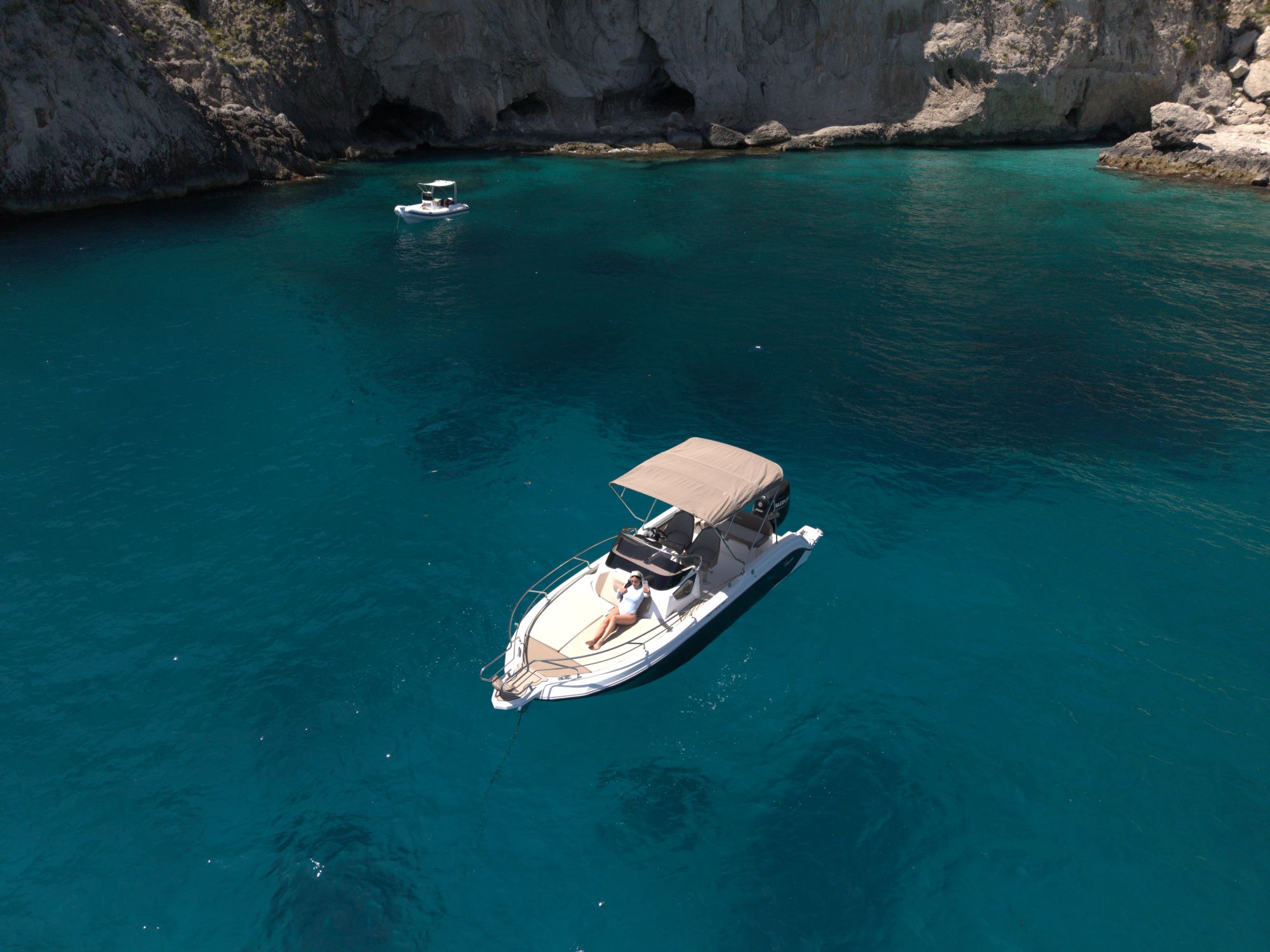 Boat in a turquoise cove near Capri