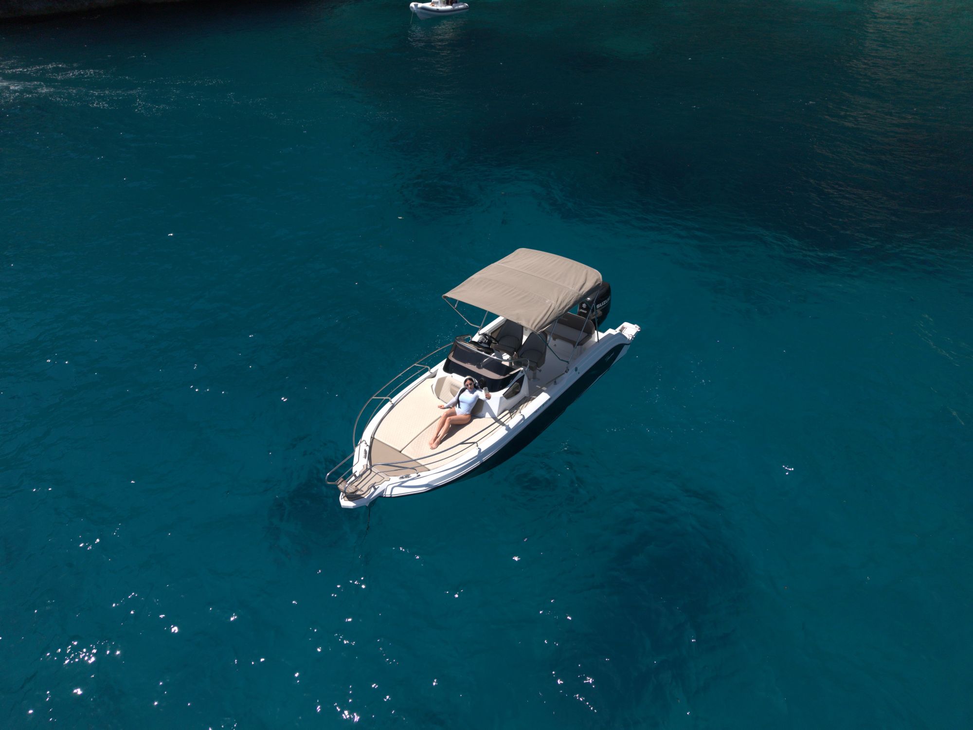 Private boat cruising the blue water of the Amalfi Coast