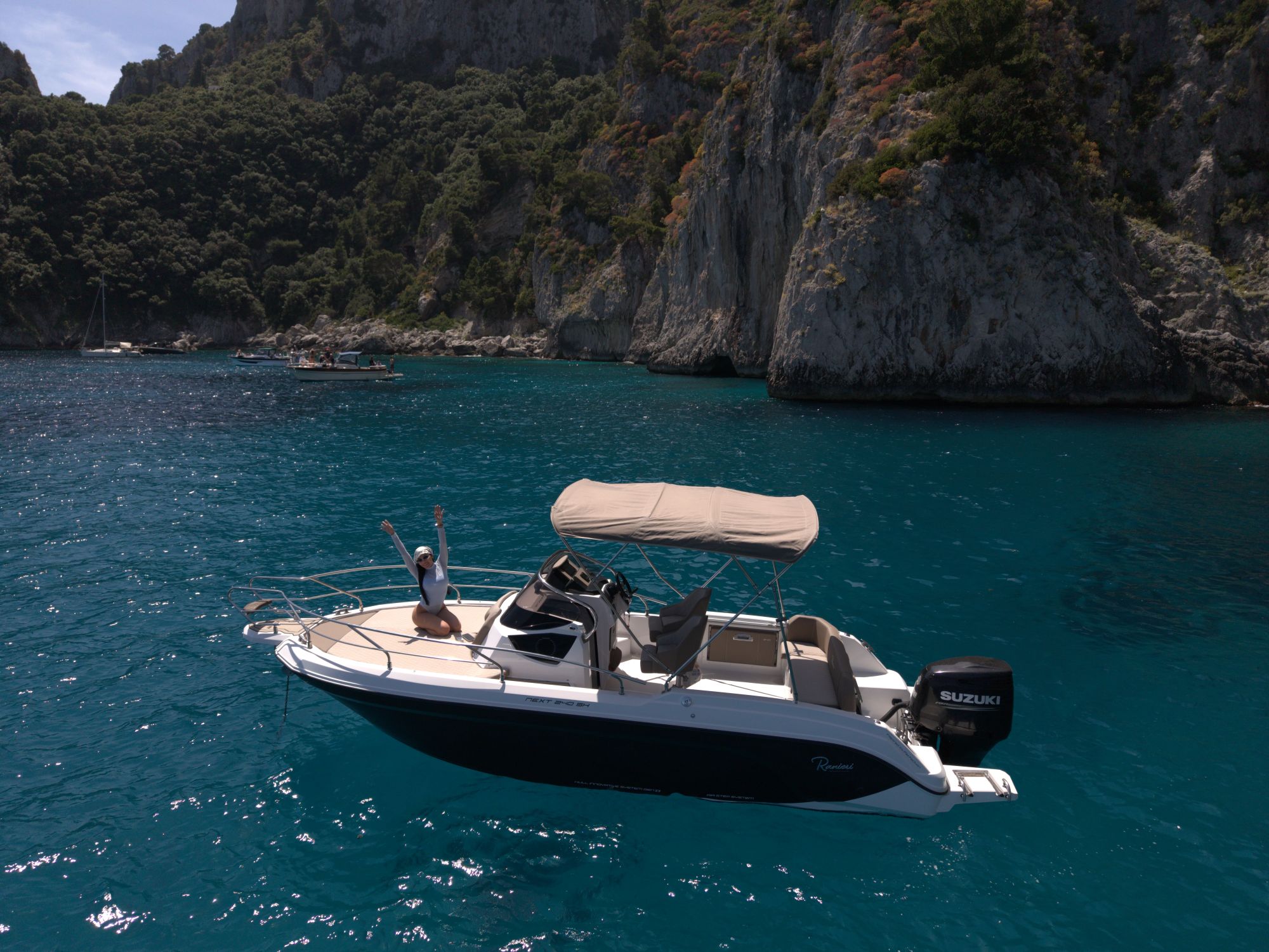 The Ranieri 24 cruising below the cliffs of Capri