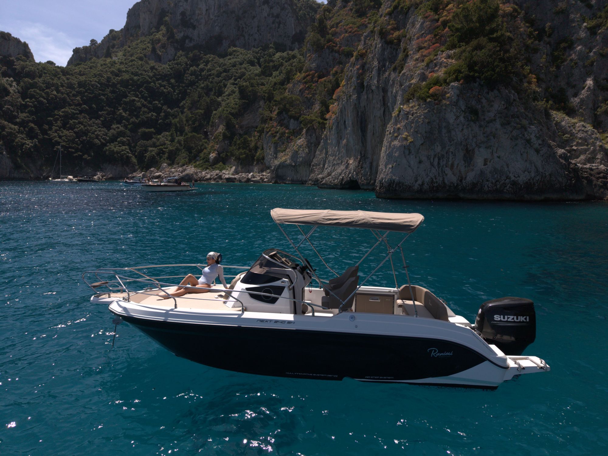 Guests aboard a Blue Amalfi Charter boat on the Capri coast